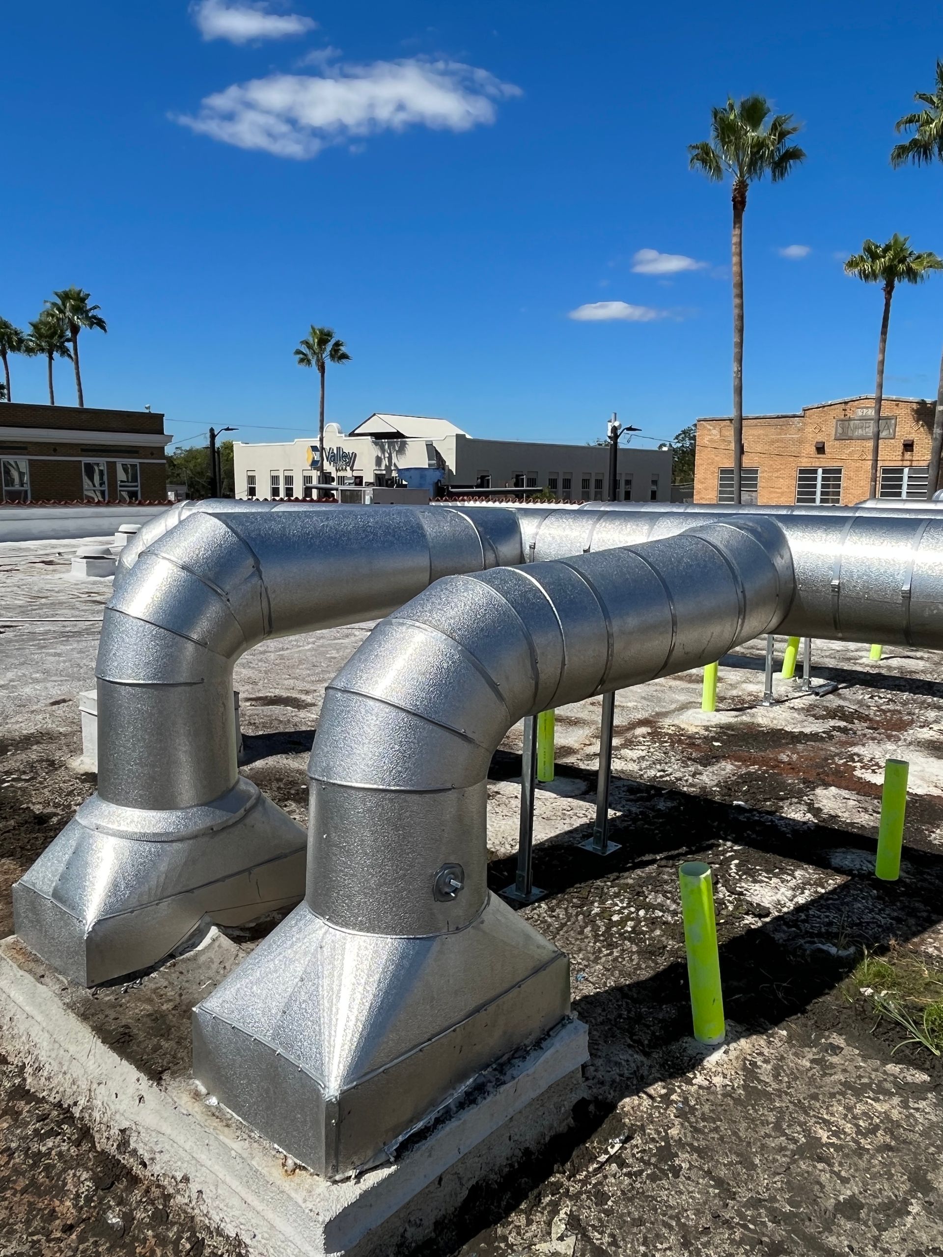 Metal-jacketed insulated vertical riser at an industrial jobsite
