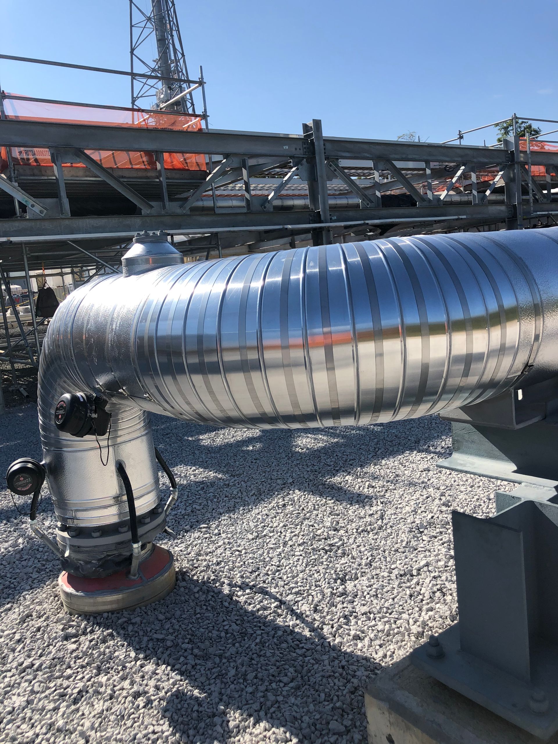Metal-jacketed process piping on a commercial rooftop