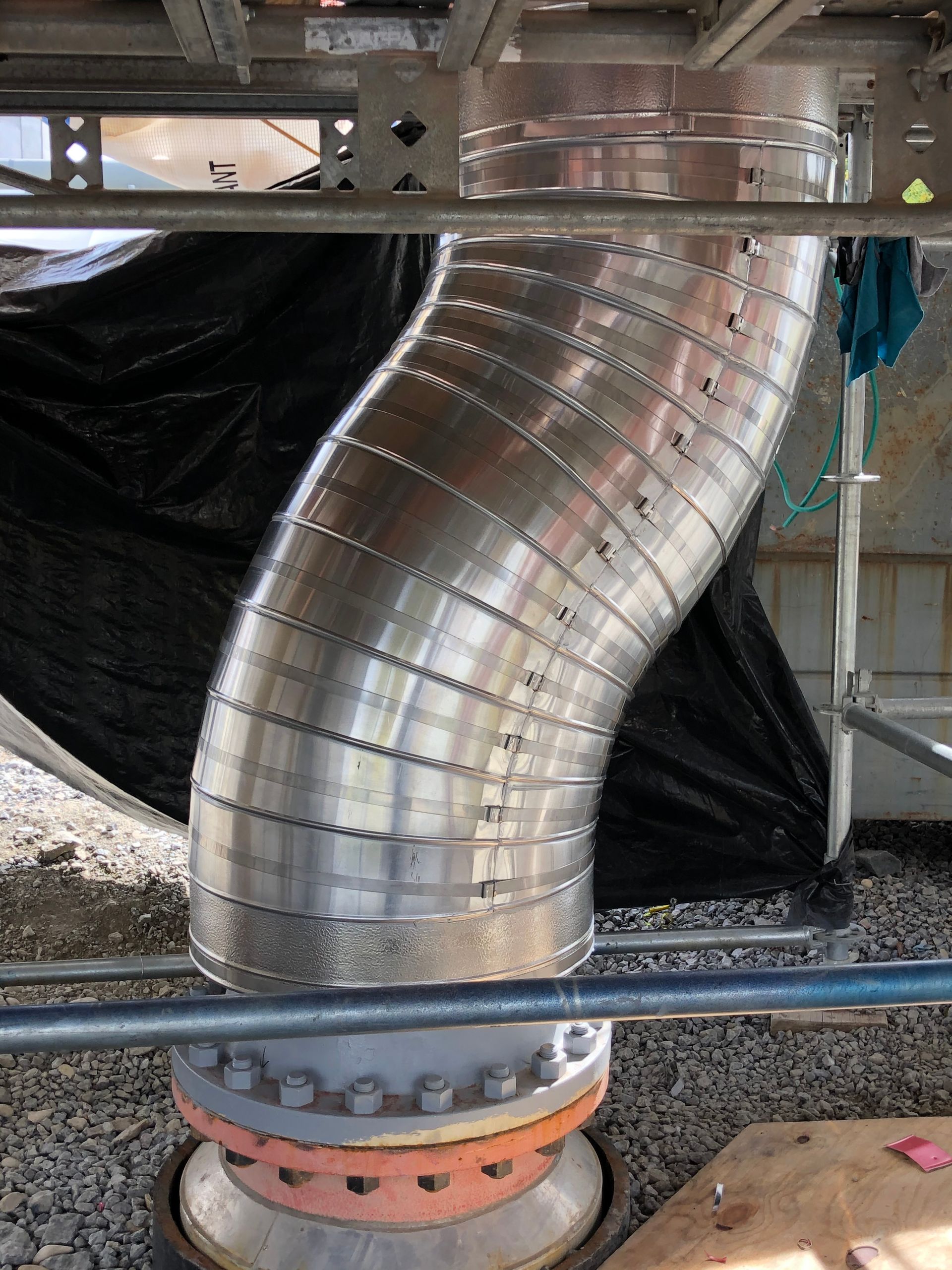 Finished metal-jacketed pipe insulation installed on site
